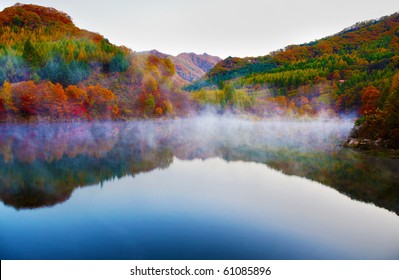 Autumn view of lake and mountain reflections in wedge pond, - Powered by Shutterstock