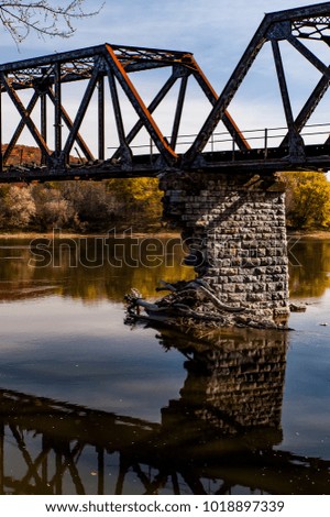 An autumn view of the long abandoned and now collapsing Coxton railroad bridge over the Susquehanna River in Luzerne County, Pennsylvania.