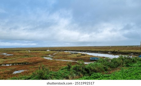 Autumn view with stormy skies across Blakeney Marshes, North Norfolk - Powered by Shutterstock