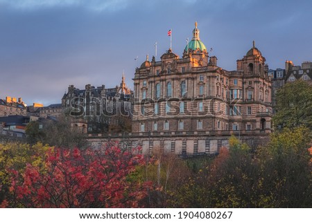 Autumn view at sunset or sunrise from Princes Street Gardens of Museum on the Mound off the Royal Mile in old town Edinburgh housed in the head office for Bank of Scotland.