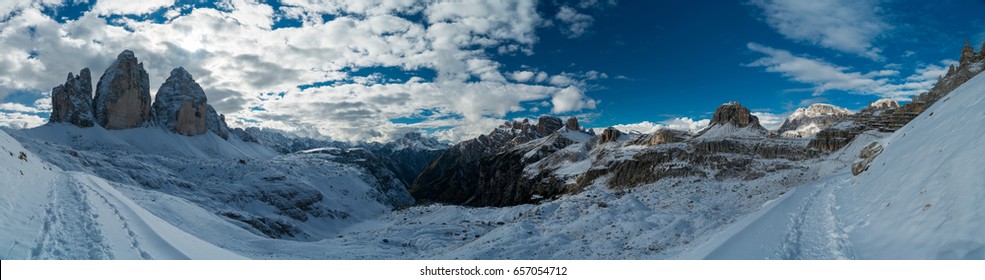 Autumn View of Tre Cime di Lavaredo (Three Peaks, Drei Zinnen) with beautiful blue sky, Dolomites, South Tyrol, Italy
