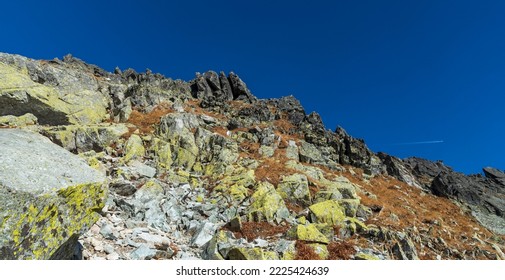 Autumn Vysoke Tatry Mountains Above Highest Part Of Furkotska Dolina Valley In Slovakia With Rocks, Grass And Clear Sky