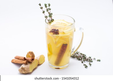 Autumn warming vitamin herbal tea with berries of red and black currants, strawberries and blackberries.garnished with orange, rosemary sprig, cinnamon stick and ginger.Photo for bar and restaurant  - Powered by Shutterstock