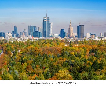 Autumn in Warsaw, colorful forest and distant city center aerial view