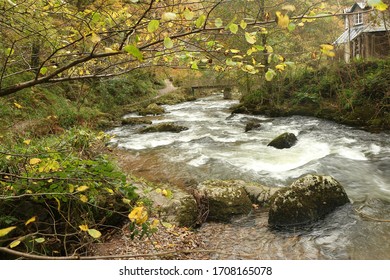 Autumn Water Cascading Down The Rapids Of The River Lyn Whilst Walking Along The Paths Of The National Trust Site Of Watersmeet