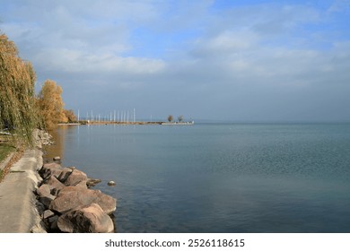 An autumn waterfront promenade by the lake. - Powered by Shutterstock