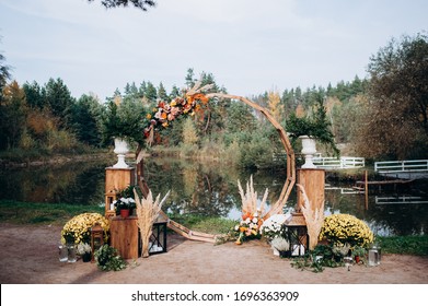 Autumn Wedding Arch With Decor And Flowers
