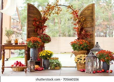 Autumn Wedding Ceremony With Flowers And Pumpkins