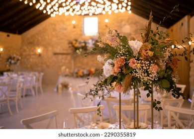 Autumn wedding table setting with flower centerpieces and candles. Wedding day. Autumn wedding decorations.