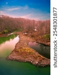 Autumn Wildlife Refugee Landscape with Bare Winter Trees and Pebble Barts at the Spillway of the O