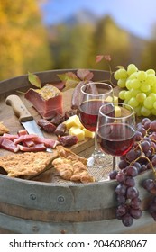 Autumn wine tasting in South Tyrol with a hearty snack consisting of bacon, salami, mountain cheese and crunchy rye bread 