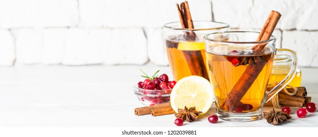 Autumn Or Winter Hot Tea With Fruit, Berries And Spices In Glass Cup.