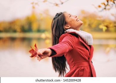 Autumn Woman Happy Smiling Feeling Free In Fall Nature. Nature People Beauty Landscape. Girl By The Lake.