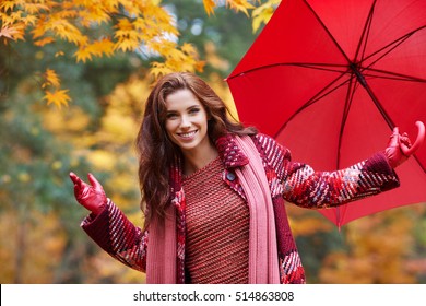 Autumn Woman In Autumn Park With Red Umbrella, Scarf And Leather Gloves