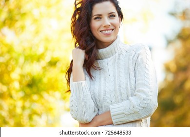 Autumn Woman In Autumn Park. Warm Sunny Weather. Fall Concept