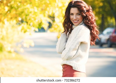 Autumn Woman In Autumn Park. Warm Sunny Weather. Fall Concept