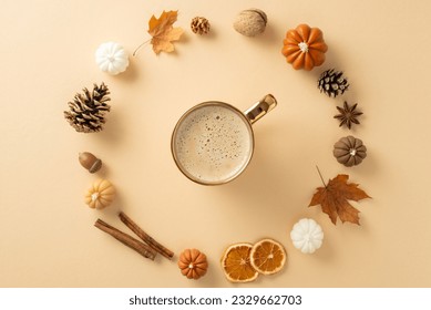 Autumnal attributes concept. Above view photo of cinnamon sticks, chinese anise, dried oranges, pinecones, acorns, maple leaves and candles forming a circle for coffee cup on grey isolated background
