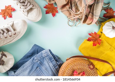 Autumnal Clothes Set. Cozy Casual Trendy Woman Clothing And Shoes - Jeans, Sweater, Bad, Sneakers. Set Of Seasonal Autumn Fashion Female Clothes, Top View Copy Space