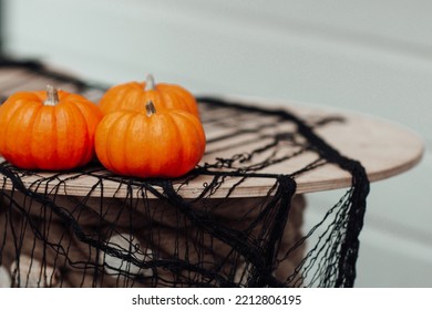 Autumnal Display Row Of Big Orange Pumpkins On Bales Of Hay At All Hallows Eve In October. Classic Fall Scene In Preparation For Halloween And Thanksgiving At Town Market