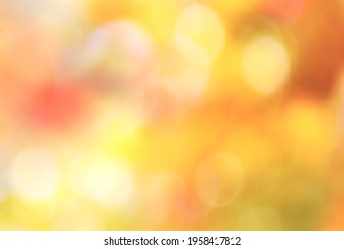 Autumn,fall Blurred Nature Background.Defocused Foliage Sunny Day.Natural Backdrop.Yellow Orange Blurred Texture.