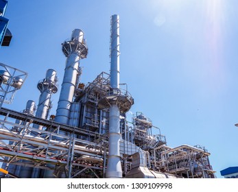 Auxiliary boiler systems from natural gas which include stack, burner, boiler and sky in power plant. - Shutterstock ID 1309109998