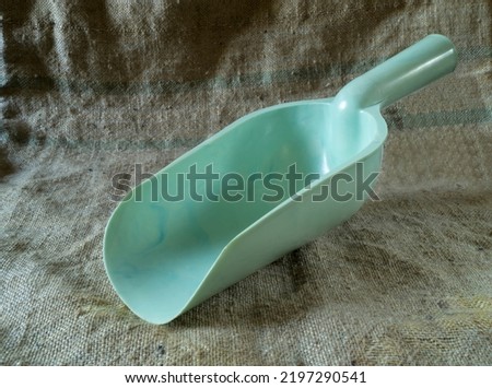 Auxiliary items on the background of burlap. Blue instrument close-up
