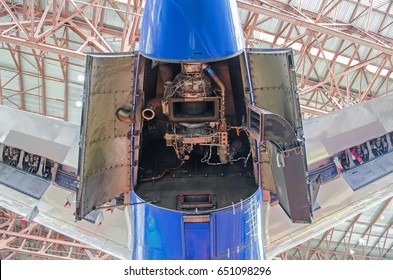 Auxiliary power plant in the tail of the aircraft with open hood covers - Shutterstock ID 651098296