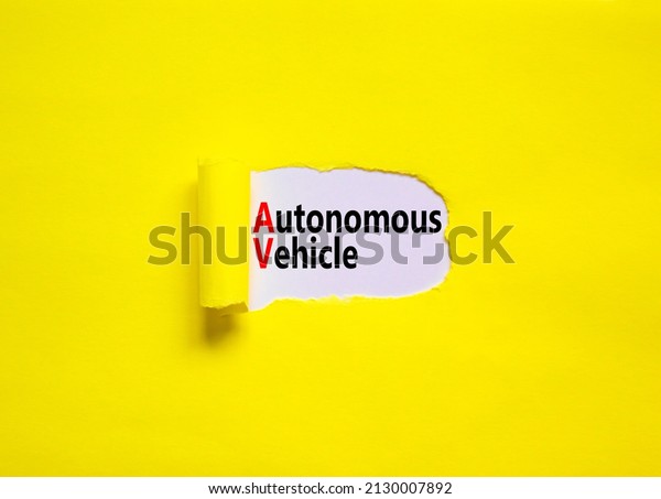 AV autonomous\
vehicle symbol. Concept words AV autonomous vehicle on white paper\
on a beautiful yellow background. Business technology AV autonomous\
vehicle concept. Copy space.
