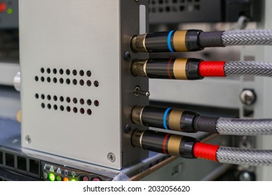 The AV cables are connected to a digital amplifier. The digital signal converter is in the rack. The multimedia equipment works in the server room.
