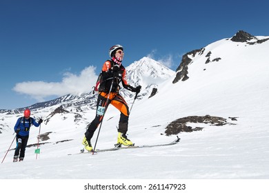 AVACHA VOLCANO, KAMCHATKA, RUSSIA - APRIL 26, 2014: Chinese Ski Mountaineer Ma Nan Climbs On Skis On Volcano. Individual Race Ski Mountaineering Asian, ISMF, Russian And Kamchatka Championship.