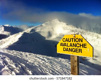 Avalanche danger sign at Kicking Horse Ski Resort in British Columbia, Canada - Shutterstock ID 571847182