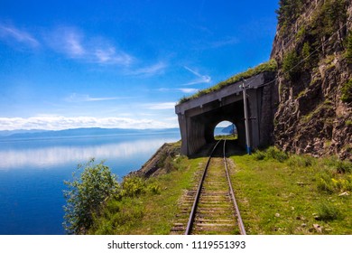 Avalanche gallery on the Circum-Baikal railway. Travel background of a summer landscape with mountains and lake Baikal for transfer of an aura of wanderlust