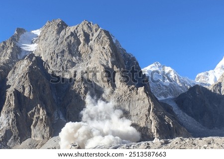 An Avalanche Is Rumbling Down a Steep Mountain Slope. Avalanche On Tirichmir Concordia 4000 meters above sea. Snow avalanche in mountain. Powerful Avalanche. Hindukush Mountains, chitral Pakistan.