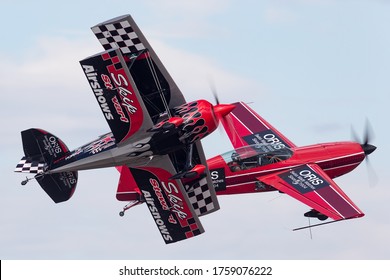 Avalon, Australia - February 28, 2015: Aerobatic pilot Skip Stewart flying his highly modified Pitts S-2S biplane Prometheus in formation with Melissa Pemberton flying in Extra 300 aerobatic aircraft.