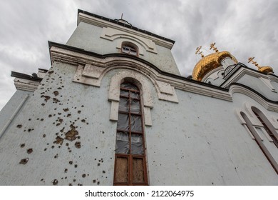 AVDIIVKA, UKRAINE - JUNE 27, 2015: Believers Pray At Avdiivka's Orthodox Church As The Sound Of Rockets Echoed In The Background. The Donbas War Opposes Ukrainian Forces To Pro-Russia Armed Groups.