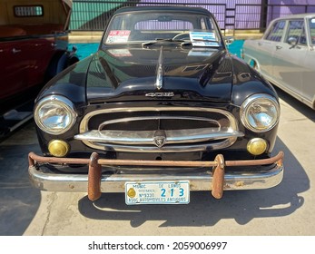 AVELLANEDA - BUENOS AIRES, ARGENTINA - Sep 27, 2021: Avellaneda, Argentina - Sept 26, 2021 - Peugeot 403 Saloon, Sedan, Late 1950s Classic Mid Size Car  Front View  Expo Fierros 2021