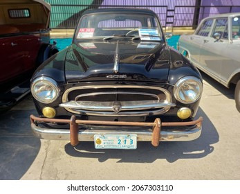 AVELLANEDA - BUENOS AIRES, ARGENTINA - Sep 27, 2021: Shot Of A Peugeot 403 Saloon, Sedan, Late 1950s Classic Mid Size Car  Front View  Expo Fierros 2021