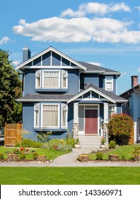 Average Family House With Blue Sky Background.