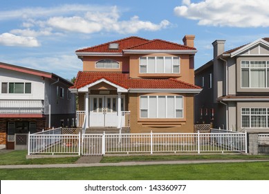 Average Family House With Blue Sky Background.