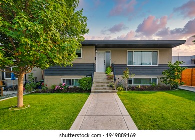 Average Family House With Concrete Pathway Over Front Yard