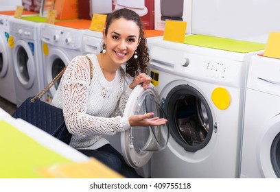 Average female looking at washers and dryers in store