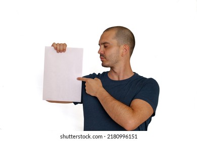 Average Looking White Short Haired Man Posing With A Blank Sheet Of Paper , Isolated Background