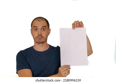 Average Looking White Short Haired Man Posing With A Blank Sheet Of Paper , Isolated Background