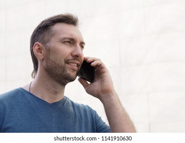 Average Man Talking On The Phone, Close Up.