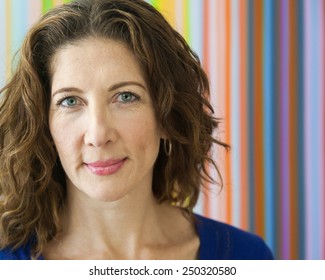 Average Middle Aged Woman, Smiling At The Camera.