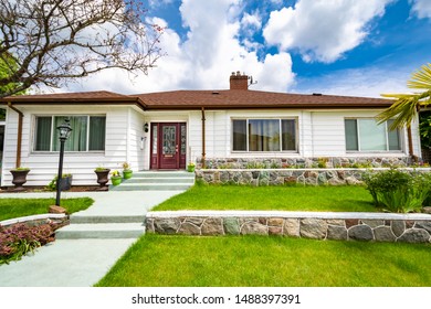 Average Residential House With Green Lawn On Land Terraces