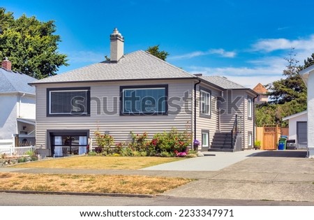 Average residential house on bright summer day