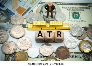 average true range (ATR) is a technical analysis indicator.The word is written on money and gold background