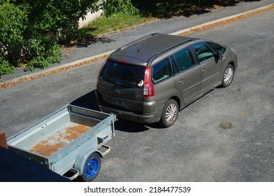 Aveyron, France - July 2022 - Top View Over A Brown Citroën C4 Picasso, Towing A Trailer ; This Model Of Family Car Was Produced By The French Manufacturer PSA Peugeot-Citroën In Vigo, Spain