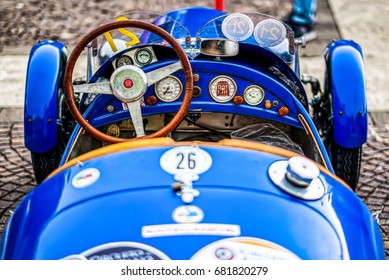 AVEZZANO, ITALY - JUNE 24, 2017: Cockpit Of Blue Vintage Sport Car. Retro Auto Photo. Historic Vehicle Dashboard, Veteran Racing Automobile Steering Wheel.